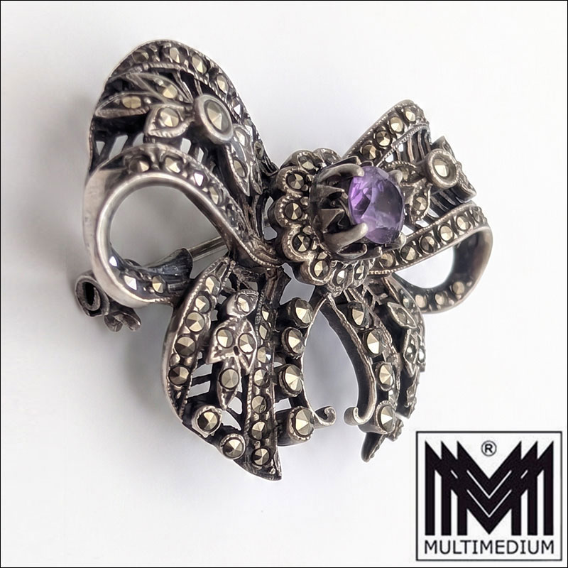 Gemini Generated Image t2g30tt2g30tt2g3 Art Déco Schleifenbrosche Silber 835 mit Amethyst & Markasiten um 1930